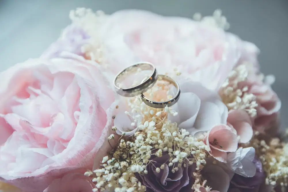 Wedding ring on top of flowers